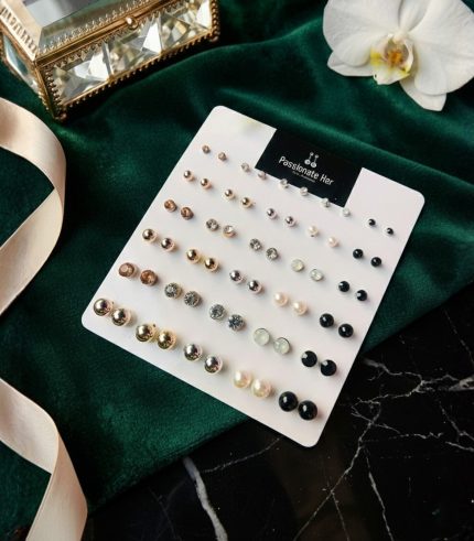 Stud earring set from Passionate Bangladesh, featuring multiple pairs of small everyday studs in different shapes and colors, budget friendly, attractive earrings and arranged on a display card.