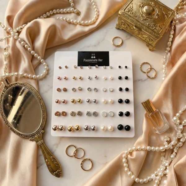 Stud earring set from Passionate Bangladesh, featuring multiple pairs of small everyday studs in different shapes and colors, budget friendly, attractive earrings and arranged on a display card.