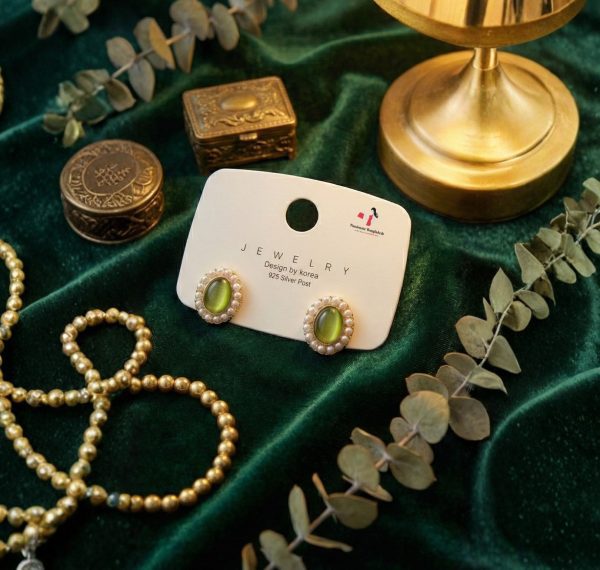 Stud earring set from Passionate Bangladesh, featuring multiple pairs of small everyday studs in different shapes and colors, budget friendly, attractive earrings and arranged on a display card.