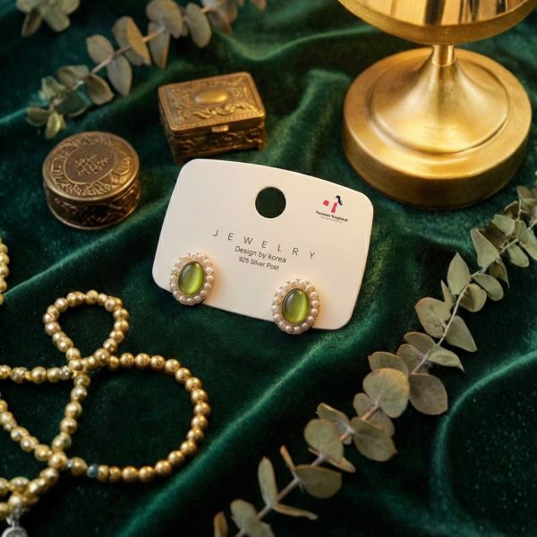 Stud earring set from Passionate Bangladesh, featuring multiple pairs of small everyday studs in different shapes and colors, budget friendly, attractive earrings and arranged on a display card.