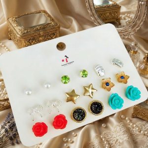 Stud earrings set from Passionate Bangladesh, featuring multiple pairs of small everyday studs in different shapes and colors, budget friendly, attractive earrings and arranged on a display card. Also, best shop for Kids earrings sets.