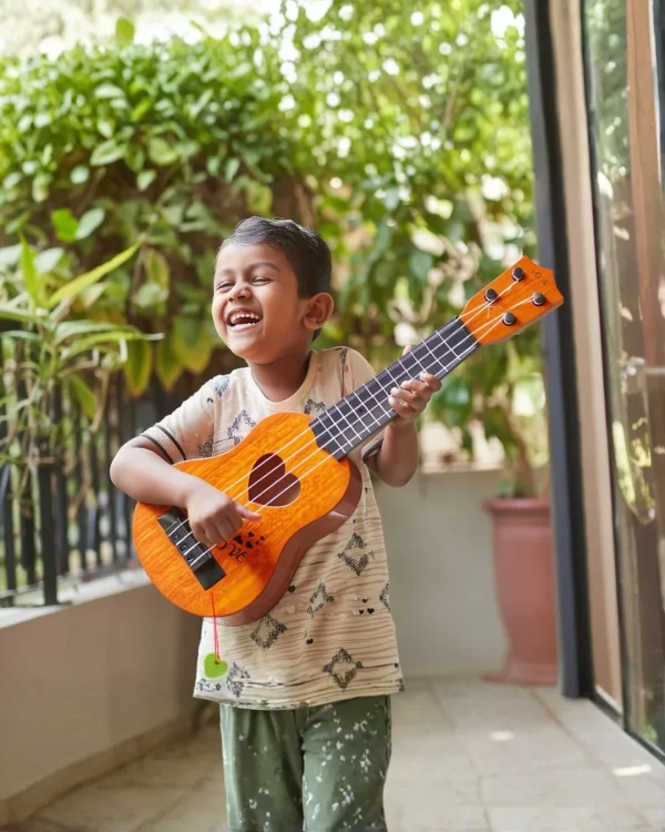 17-inch acoustic toy guitar for children available at Passionate Bangladesh.