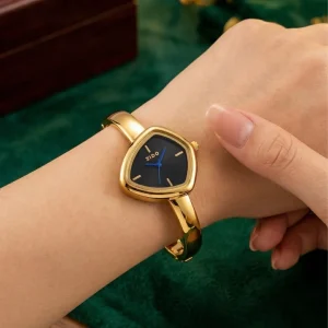 Shop golden triangle dial slim wrist watch for women. Elegant, lightweight, and stylish design perfect for daily wear, office, and parties. Limited Stocks !! https://passionatebangladesh.com/product-category/accessories/