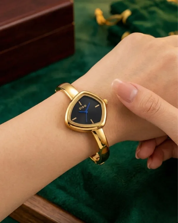 Shop golden triangle dial slim wrist watch for women. Elegant, lightweight, and stylish design perfect for daily wear, office, and parties. Limited Stocks !! https://passionatebangladesh.com/product-category/accessories/