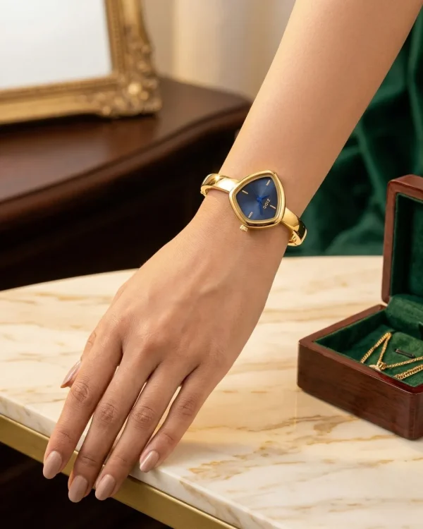 Shop golden triangle dial slim wrist watch for women. Elegant, lightweight, and stylish design perfect for daily wear, office, and parties. Limited Stocks !! https://passionatebangladesh.com/product-category/accessories/