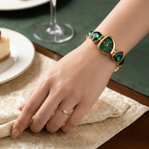 Shop green emerald color stone golden wrist watch for women. Elegant, lightweight, and stylish design perfect for daily wear, office, and parties. Limited Stocks !! https://passionatebangladesh.com/product-category/accessories/