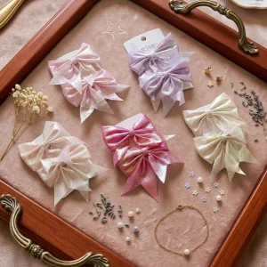 Cute hair accessories collection with multicolor bow clips, hair ribbons, hairbands and teddy bear or bunny hairbands for girls and kids from Passionate Bangladesh.