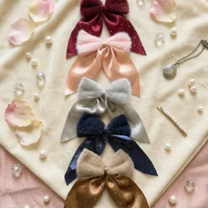 Cute hair accessories collection with multicolor bow clips, hair ribbons, hairbands and teddy bear or bunny hairbands for girls and kids from Passionate Bangladesh.