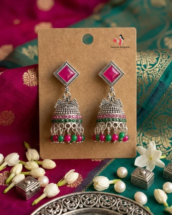 Traditional oxidized-style jhumka earrings with red, yellow and blue stones, perfect for saree, salwar and festive party looks from Passionate Bangladesh. Shop now at www.passionatebangladesh.com