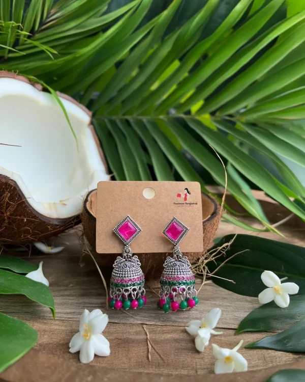 Traditional oxidized-style jhumka earrings with red, yellow and blue stones, perfect for saree, salwar and festive party looks from Passionate Bangladesh. Shop now at www.passionatebangladesh.com