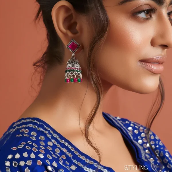 Traditional oxidized-style jhumka earrings with red, yellow and blue stones, perfect for saree, salwar and festive party looks from Passionate Bangladesh. Shop now at www.passionatebangladesh.com