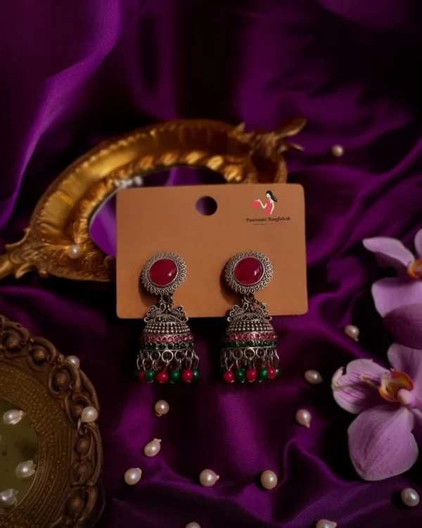 Traditional oxidized-style jhumka earrings with red, yellow and blue stones, perfect for saree, salwar and festive party looks from Passionate Bangladesh. Shop now at www.passionatebangladesh.com