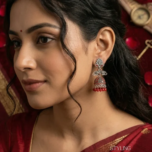 Traditional oxidized-style jhumka earrings with red, yellow and blue stones, perfect for saree, salwar and festive party looks from Passionate Bangladesh. Shop now at www.passionatebangladesh.com