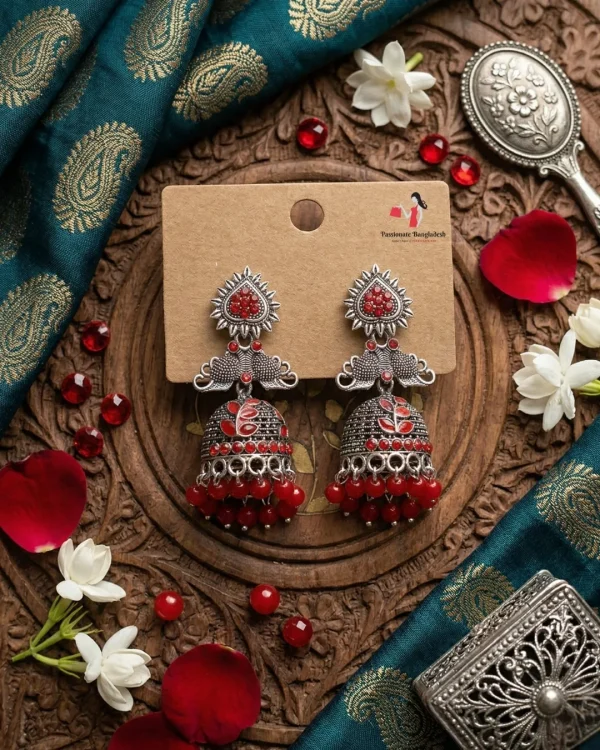 Traditional oxidized-style jhumka earrings with red, yellow and blue stones, perfect for saree, salwar and festive party looks from Passionate Bangladesh. Shop now at www.passionatebangladesh.com