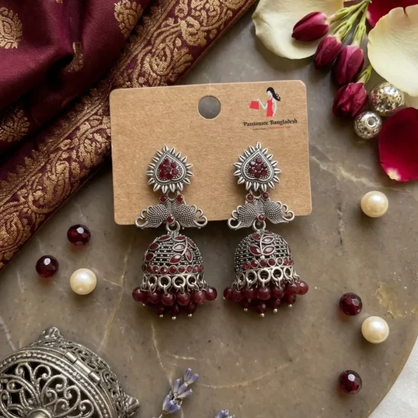 Traditional oxidized-style jhumka earrings with red, yellow and blue stones, perfect for saree, salwar and festive party looks from Passionate Bangladesh. Shop now at www.passionatebangladesh.com