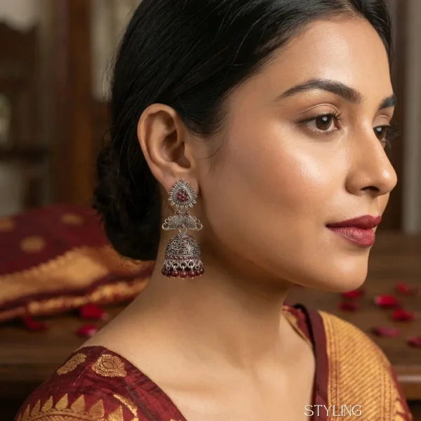 Traditional oxidized-style jhumka earrings with red, yellow and blue stones, perfect for saree, salwar and festive party looks from Passionate Bangladesh. Shop now at www.passionatebangladesh.com
