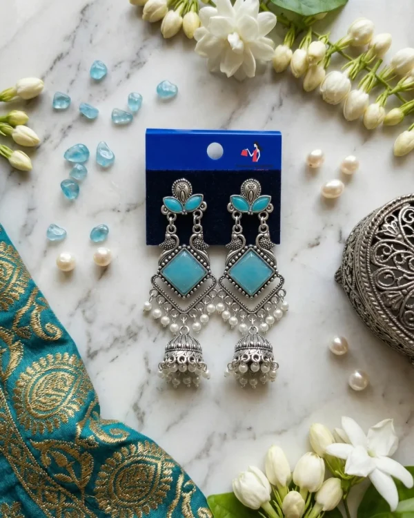 Traditional oxidized-style jhumka earrings with red, yellow and blue stones, perfect for saree, salwar and festive party looks from Passionate Bangladesh. Shop now at www.passionatebangladesh.com