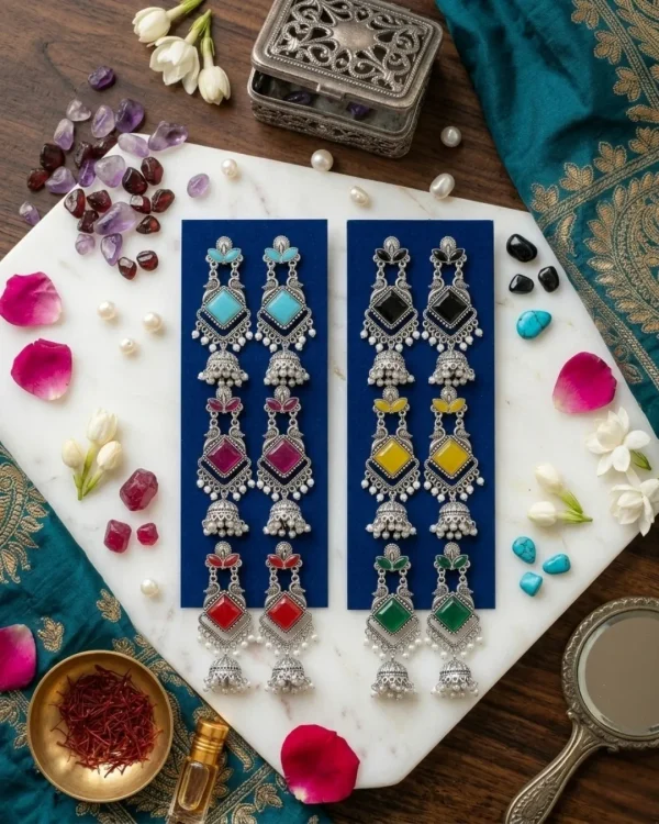 Traditional oxidized-style jhumka earrings with red, yellow and blue stones, perfect for saree, salwar and festive party looks from Passionate Bangladesh. Shop now at www.passionatebangladesh.com