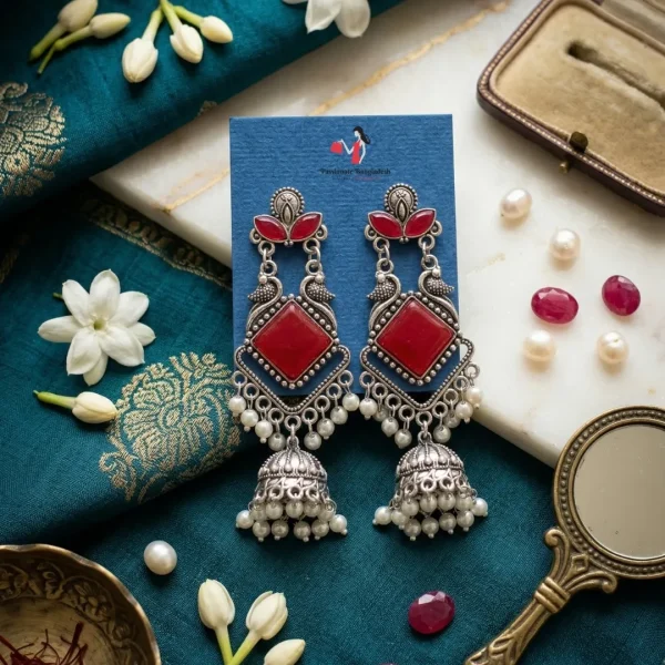 Traditional oxidized-style jhumka earrings with red, yellow and blue stones, perfect for saree, salwar and festive party looks from Passionate Bangladesh. Shop now at www.passionatebangladesh.com