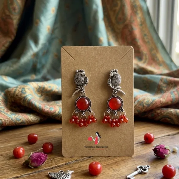 Traditional oxidized-style jhumka earrings with red, yellow and blue stones, perfect for saree, salwar and festive party looks from Passionate Bangladesh. Shop now at www.passionatebangladesh.com