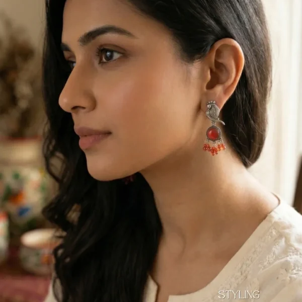 Traditional oxidized-style jhumka earrings with red, yellow and blue stones, perfect for saree, salwar and festive party looks from Passionate Bangladesh. Shop now at www.passionatebangladesh.com