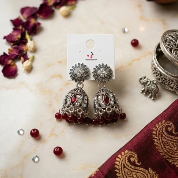 Traditional oxidized-style jhumka earrings with red, yellow and blue stones, perfect for saree, salwar and festive party looks from Passionate Bangladesh. Shop now at www.passionatebangladesh.com