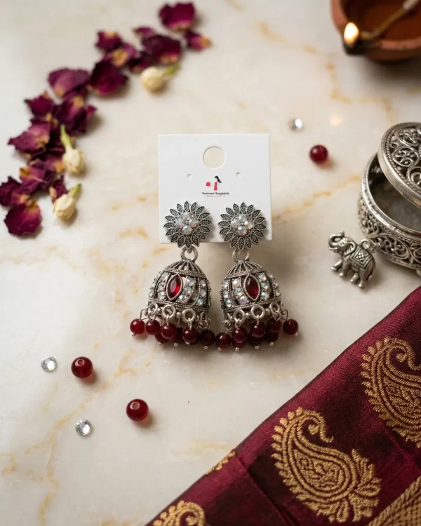Traditional oxidized-style jhumka earrings with red, yellow and blue stones, perfect for saree, salwar and festive party looks from Passionate Bangladesh. Shop now at www.passionatebangladesh.com