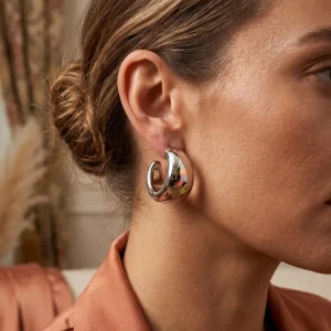 Silver HOOP Earrings for girls and women at PASSIONATE BANGLADESH at a very affordable and cheap price. Beauty with silver dazzling plastic earrings pair. Party on at disco.