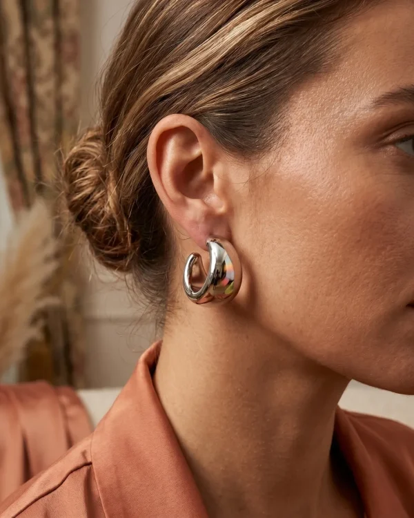 Silver HOOP Earrings for girls and women at PASSIONATE BANGLADESH at a very affordable and cheap price. Beauty with silver dazzling plastic earrings pair. Party on at disco.